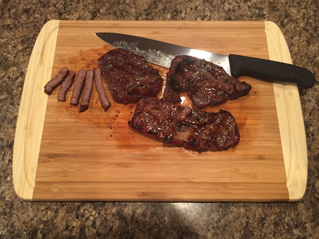 Cutting meat on the Greener Chef cutting board